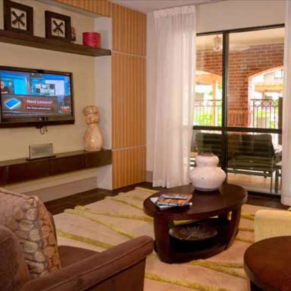 a living room filled with furniture and a wall with