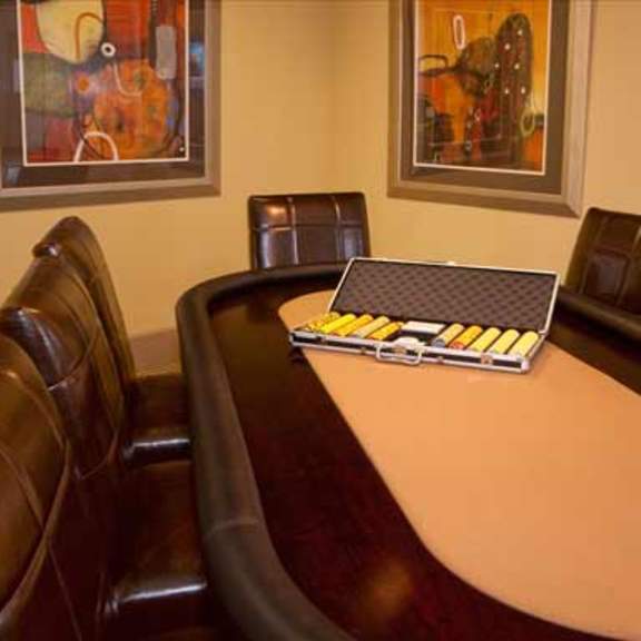 a conference room with leather chairs and a wooden conference table
