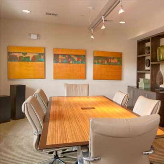 a glass wall with a bunch of chairs on it