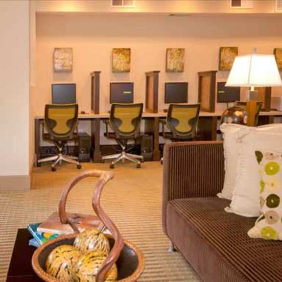 a living room filled with furniture and a table with chairs
