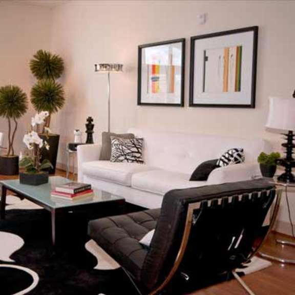 a living room with a white couch and a coffee table