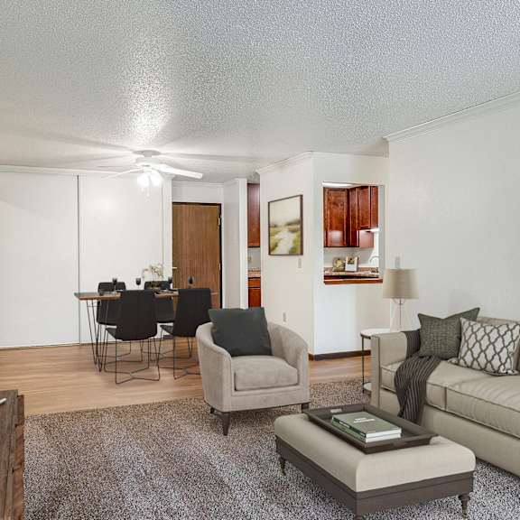 a living room with a couch and a chair and a dining room at pheasant park apartments, minnesota, 55428-5401
