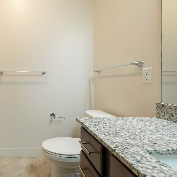 a bathroom with a toilet and a bathtub at sonder house, minnesota, 55430