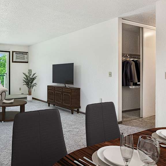 a living room and dining room with a couch and a tv at pheasant park apartments, minnesota