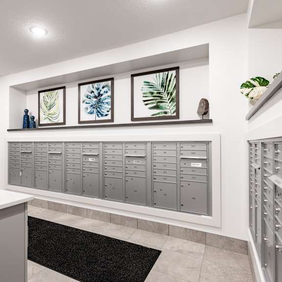 the laundry room has plenty of lockers and a granite counter top