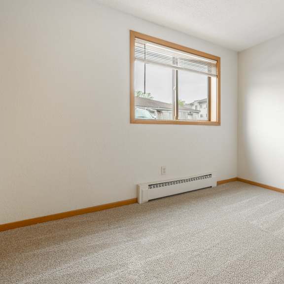 the living room of a house with a window at ames lake neighborhood apartments, st. paul, minnesota