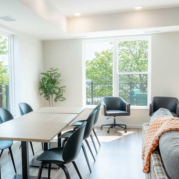 a conference room with a long table and chairs.