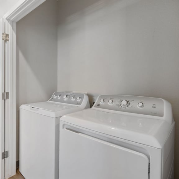 a white washer and dryer in a laundry room at copa flats apartments, arizona, 85138