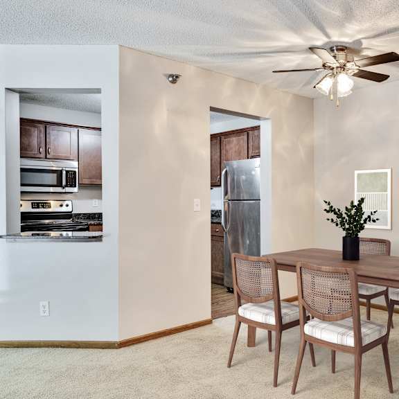 a dining room with a table and chairs. at crosby pointe apartments, st. paul , minnesota