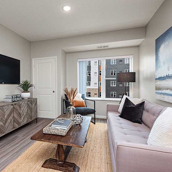 living room with tv at decatur landing i & ii, brooklyn park