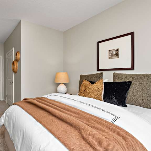 comfortable bedroom at decatur landing i & ii, minnesota