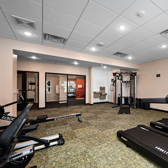 a gym with treadmills and exercise equipment.at decatur landing i & ii, brooklyn park, mn