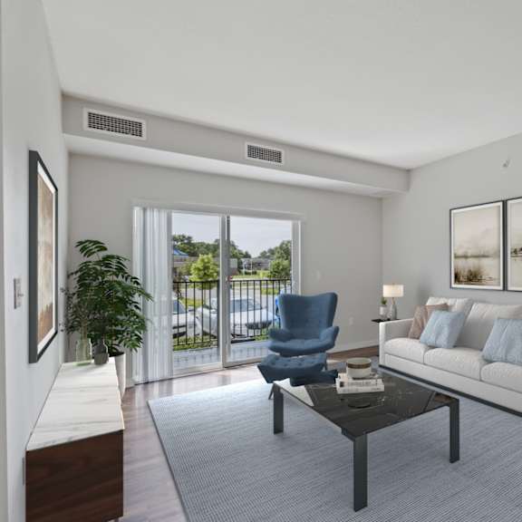 a living room with a couch and a chair and a sliding glass door at eastgate apartments, rochester, mn, 55904