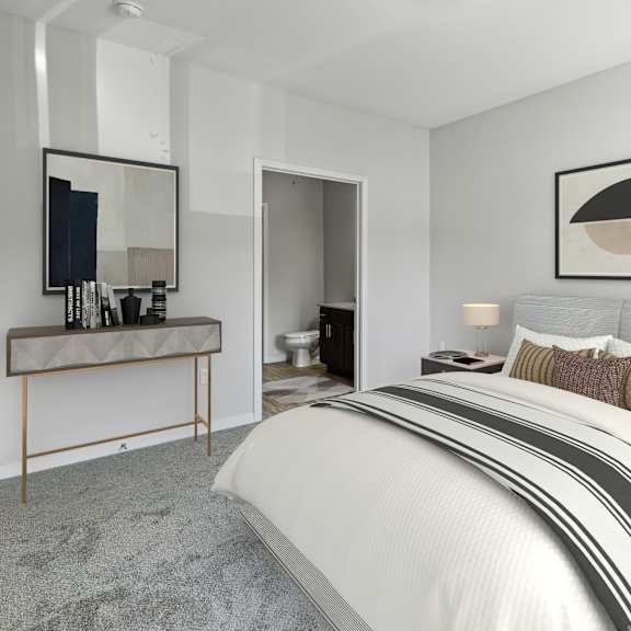 a bedroom with a bed and a desk with a mirror at eastgate apartments, rochester