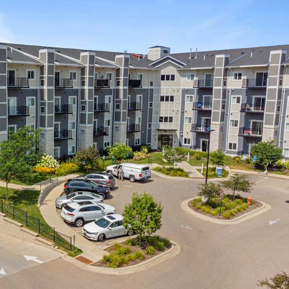 an aerial view of an apartment complex with cars parked in a parking lot at eastgate apartments, rochester, minnesota