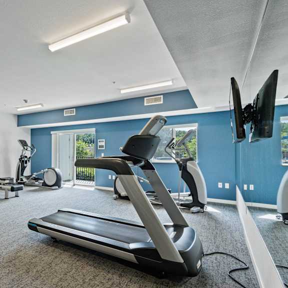 the gym with treadmills and other exercise equipment at the belgard apartments at eastgate apartments, minnesota