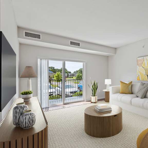a living room with a white couch, a brown coffee table, and a large painting on the wall at eastgate apartments, minnesota, 55904