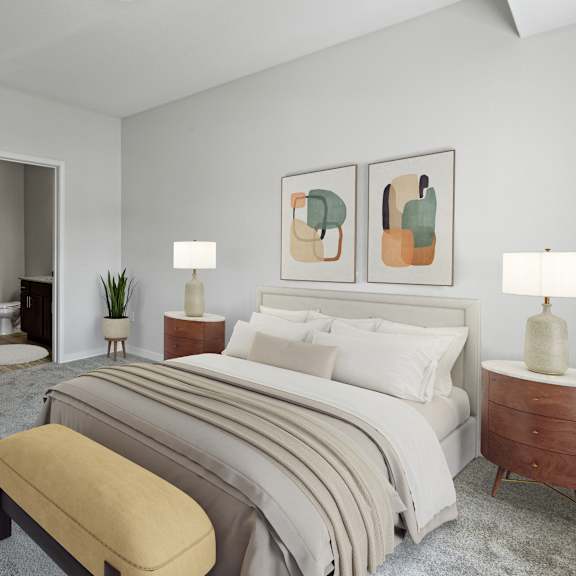 a bedroom with a large bed, a bench, and a mirror at eastgate apartments, rochester