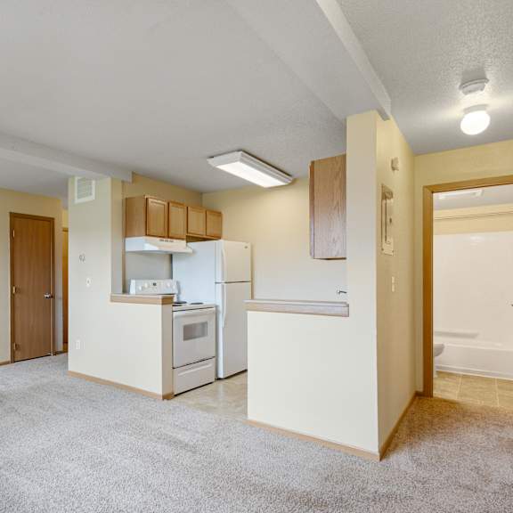 a kitchen with white appliances and a white refrigerator at ames lake neighborhood apartments, st paul 55106