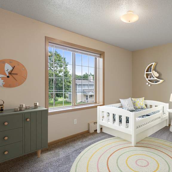 a nursery with a crib and a dresser and a window at ames lake neighborhood apartments, st. paul, mn