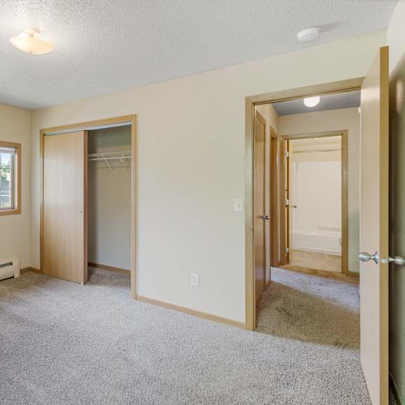 a room with a carpeted floor and a window at ames lake neighborhood apartments, minnesota, 55106