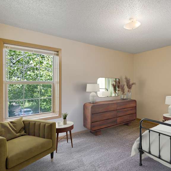 bedroom with a bed at ames lake neighborhood apartments, st. paul, 55106
