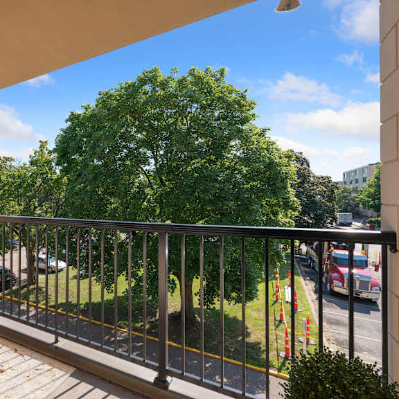 a balcony with a couch and a tree at humboldt senior 55+ apartments, minnesota, 55107