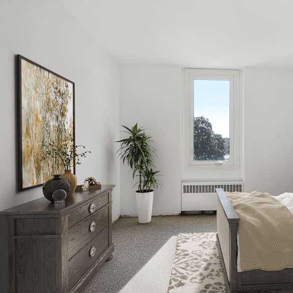 a bedroom with a bed and a dresser and a window at humboldt senior 55+ apartments, saint paul, minnesota
