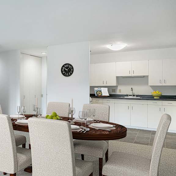 a dining room with a table and chairs and a kitchen at humboldt senior 55+ apartments, saint paul, mn, 55107