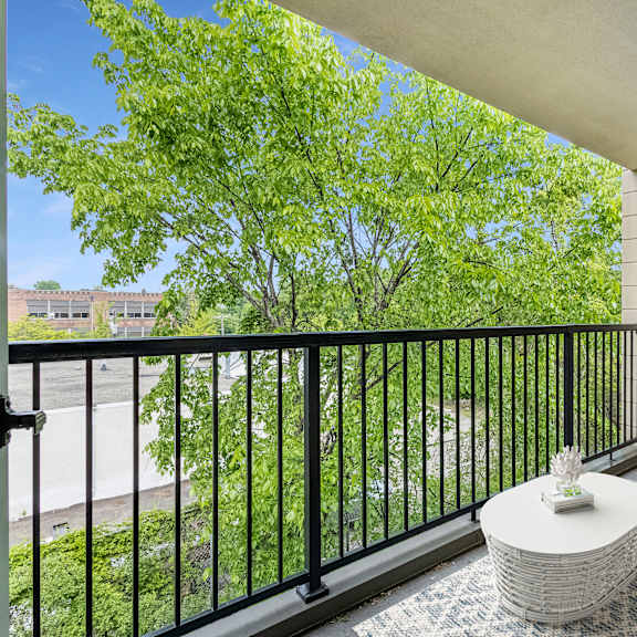 a living room with a couch and a table on a balcony at humboldt senior 55+ apartments, minnesota, 55107