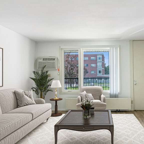 a living room with a couch and a coffee table at humboldt senior 55+ apartments, saint paul