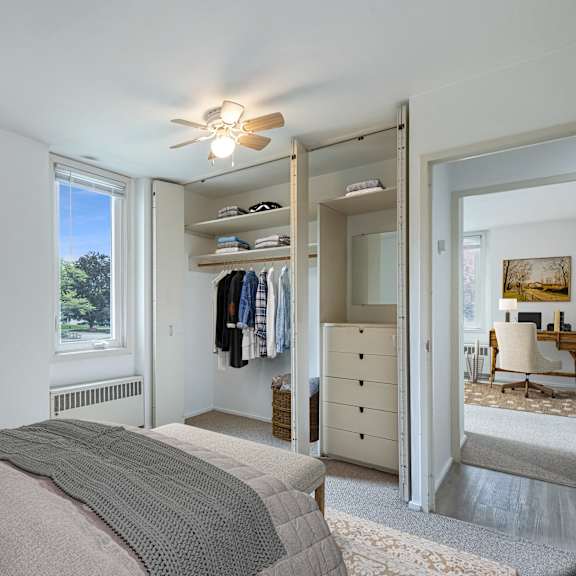 a bedroom with a bed and a closet at humboldt senior 55+ apartments, minnesota