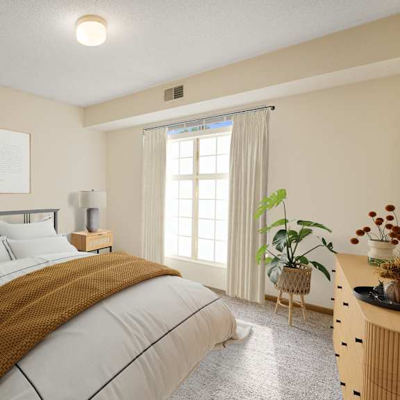 a bedroom with a bed and a window at ames lake neighborhood apartments, st. paul, minnesota