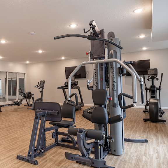 weight lifting machines in fitness room