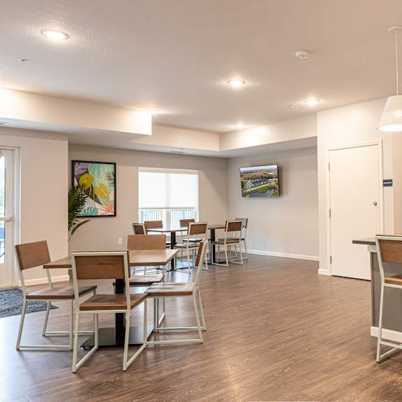 club room with kitchen and dining
