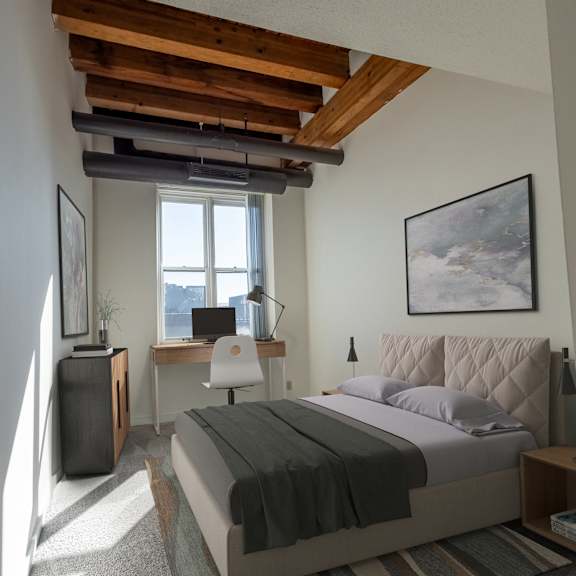 a bedroom with a bed and a desk and a window