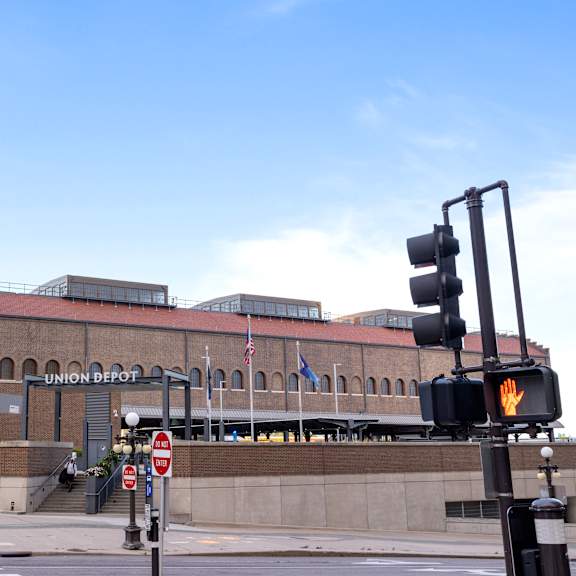 a large brick building with a traffic light in front of it