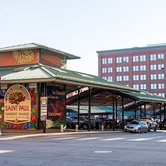 a street view of a market with a sign that says saint paul. at parkside apartments, minnesota