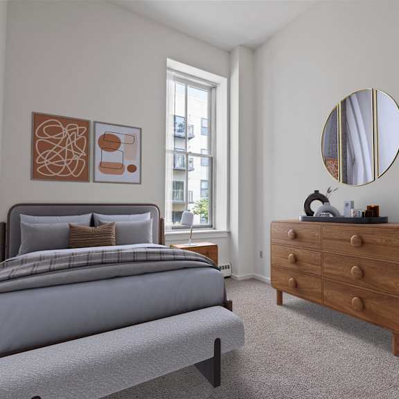 a bedroom with a bed, dresser, and mirror. at parkside apartments, st. paul