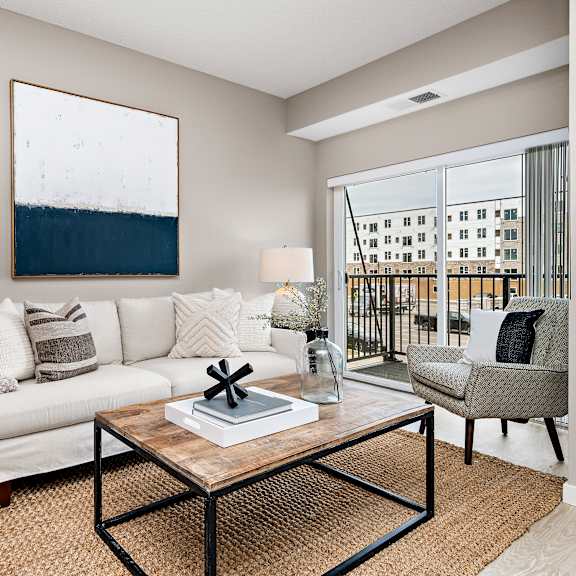living room with sofa and coffee table at reserve at settlers ridge apartments, minnesota