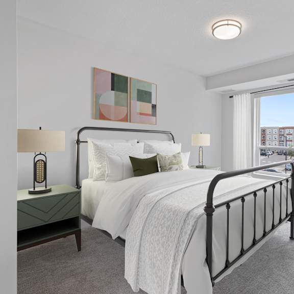 a bedroom with a large bed and a window