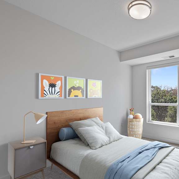a bedroom with a bed and a large window