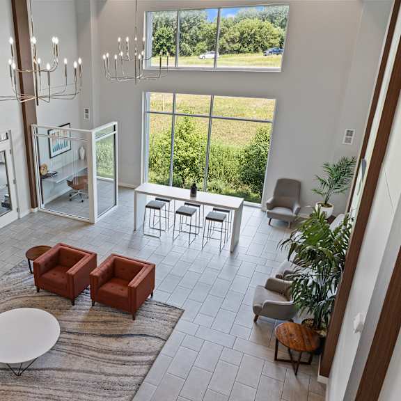 an open living room with a fireplace and a rug