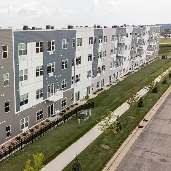 an aerial view of an apartment building on a city street at technology park apartments, rochester, mn