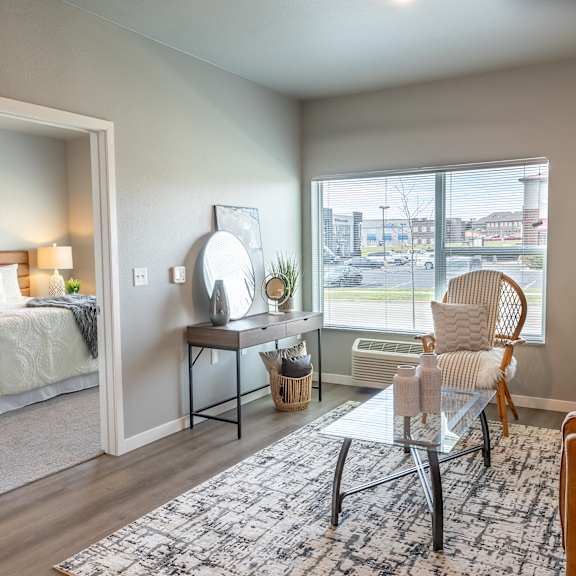 an open living room with a bedroom in the background at technology park apartments, rochester, 55901