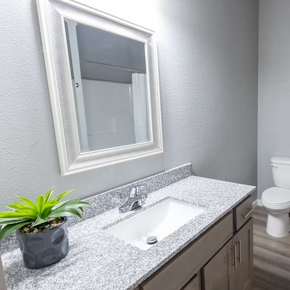 a bathroom with a sink and a toilet at technology park apartments, rochester, mn, 55901