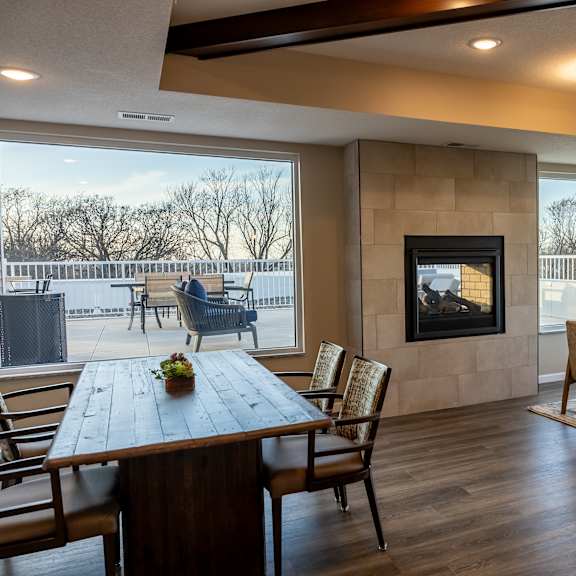 the retreat dining room with table and chairs and a fireplace