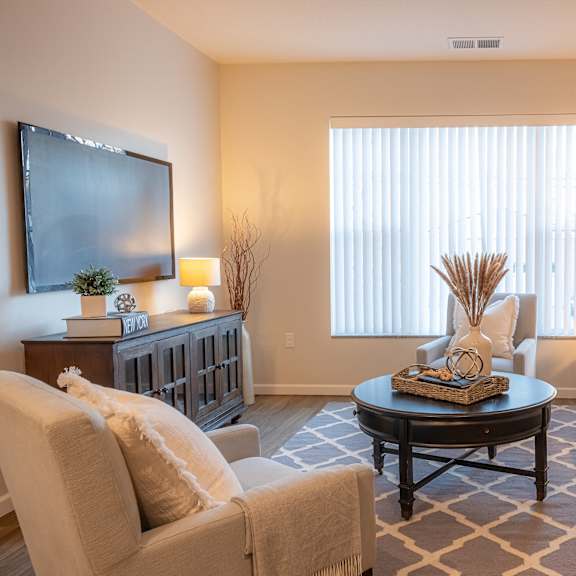 a living room with couches and a coffee table