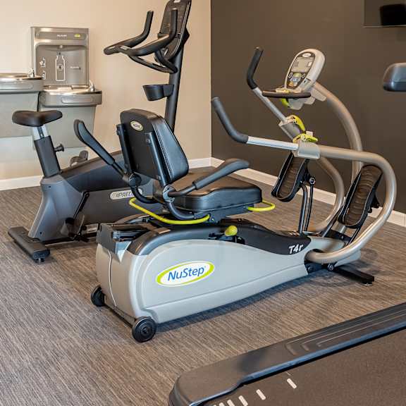 a workout room with exercise equipment at the inn at the crossroads