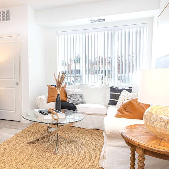 a living room with a couch and a table and a television
